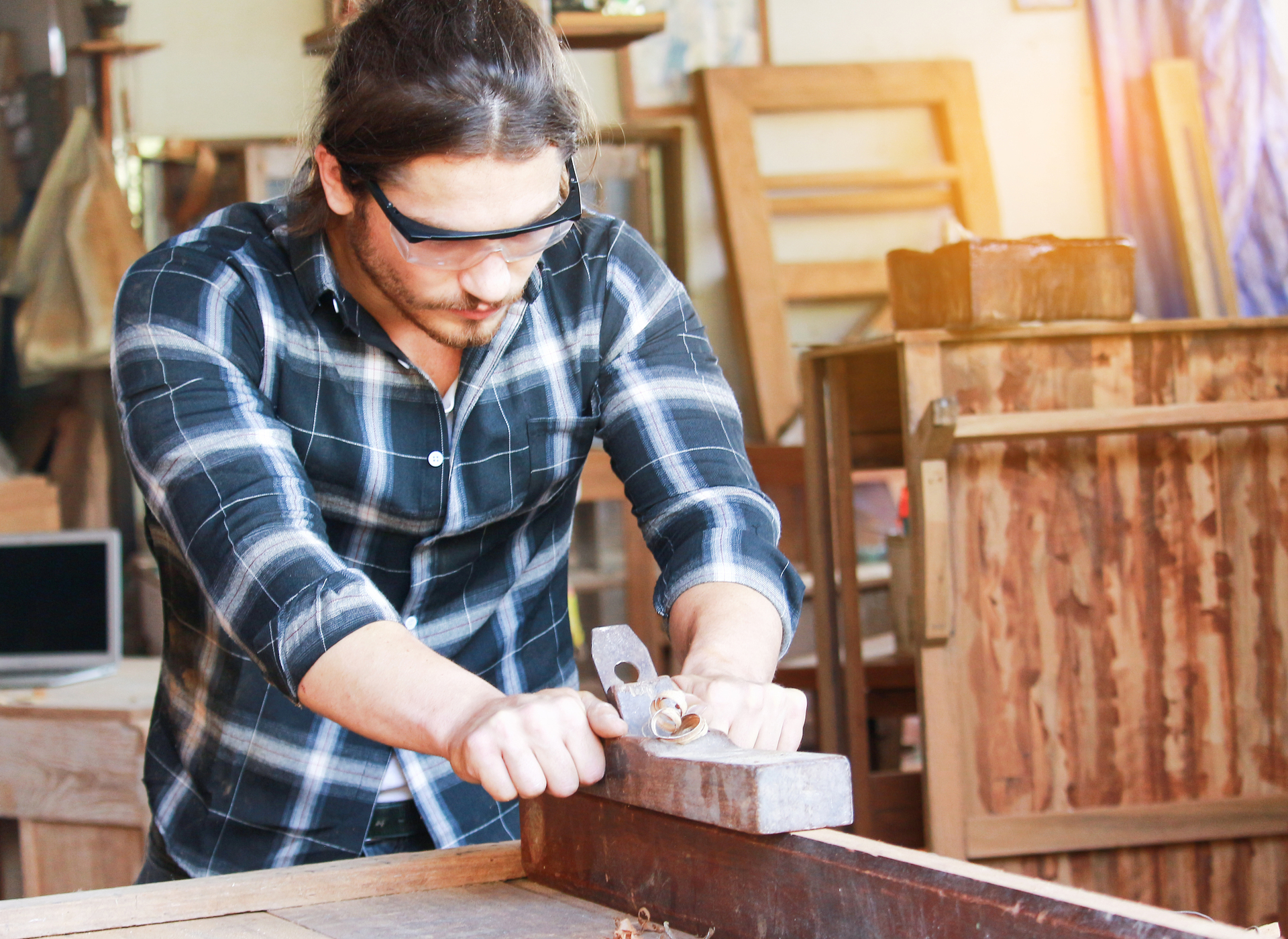 1920-a-handsome-young-carpenter-is-processing-wood-for-furniture.jpg