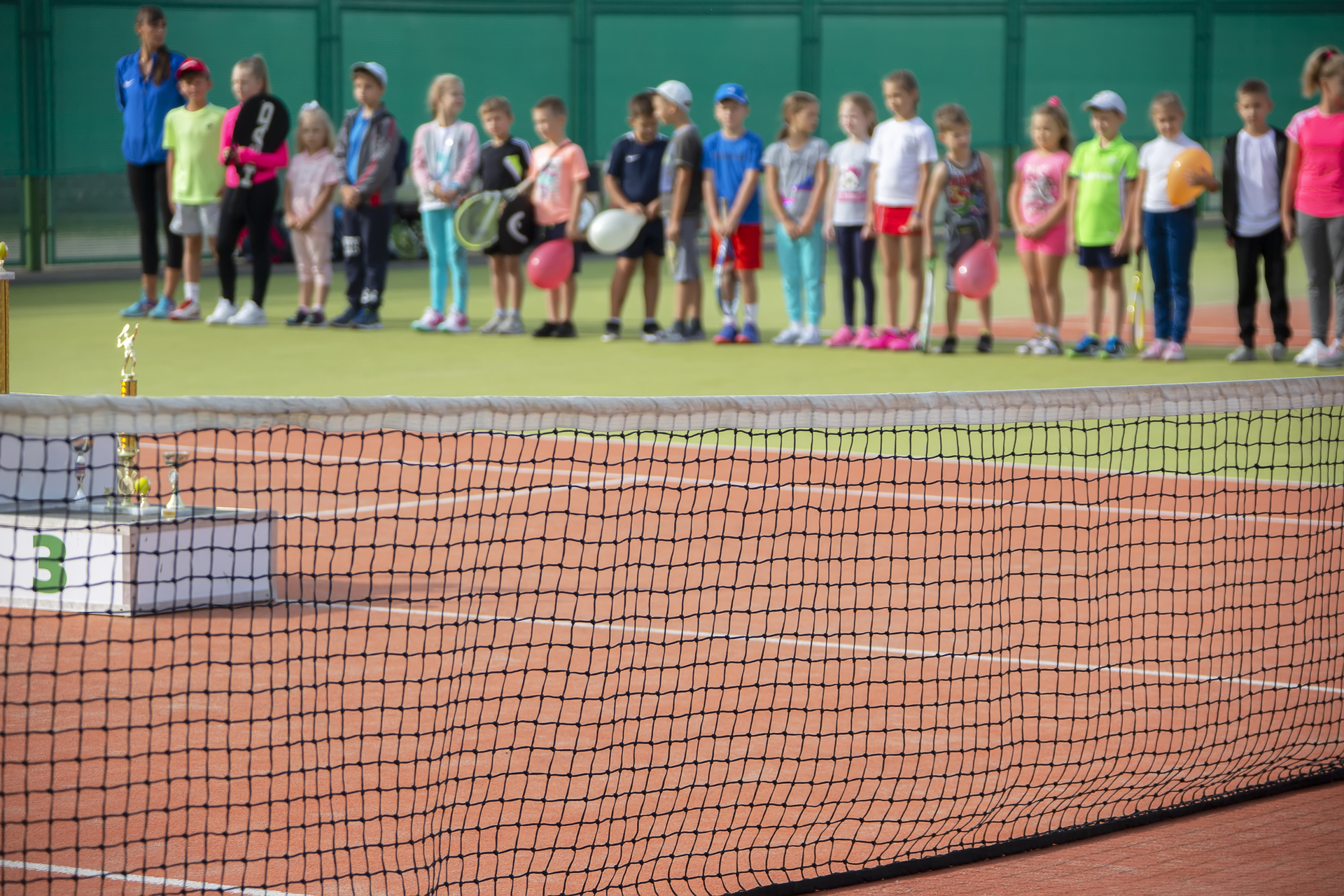 1920-belarus-the-city-of-hamel-september-08-2018-open-tennis-courts-blurred-group-of-children-on-the-background-of-tennis-courts.jpg