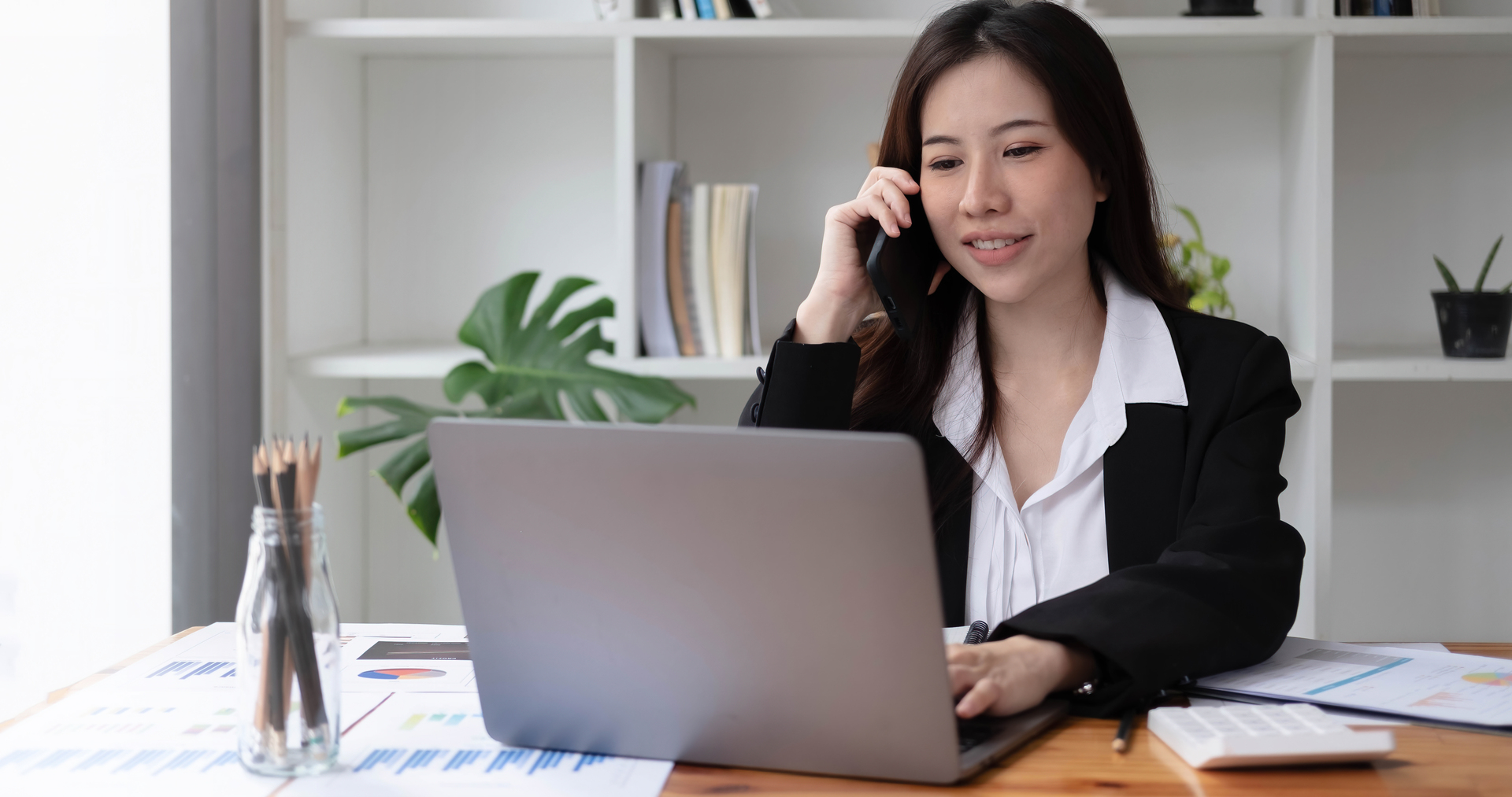 1920-business-asian-woman-using-smartphone-for-do-math-finance-on-wooden-desk-in-office-tax-accounting-financial-concept.jpg