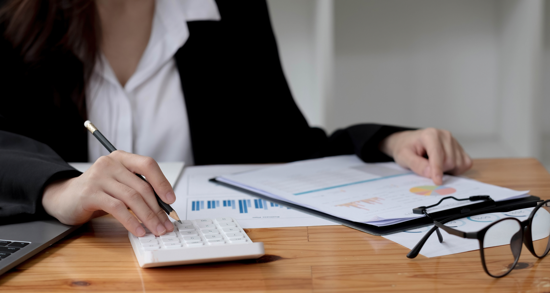 1920-businesswoman-or-accountant-working-with-calculator-for-investigation-of-corruption-account.jpg