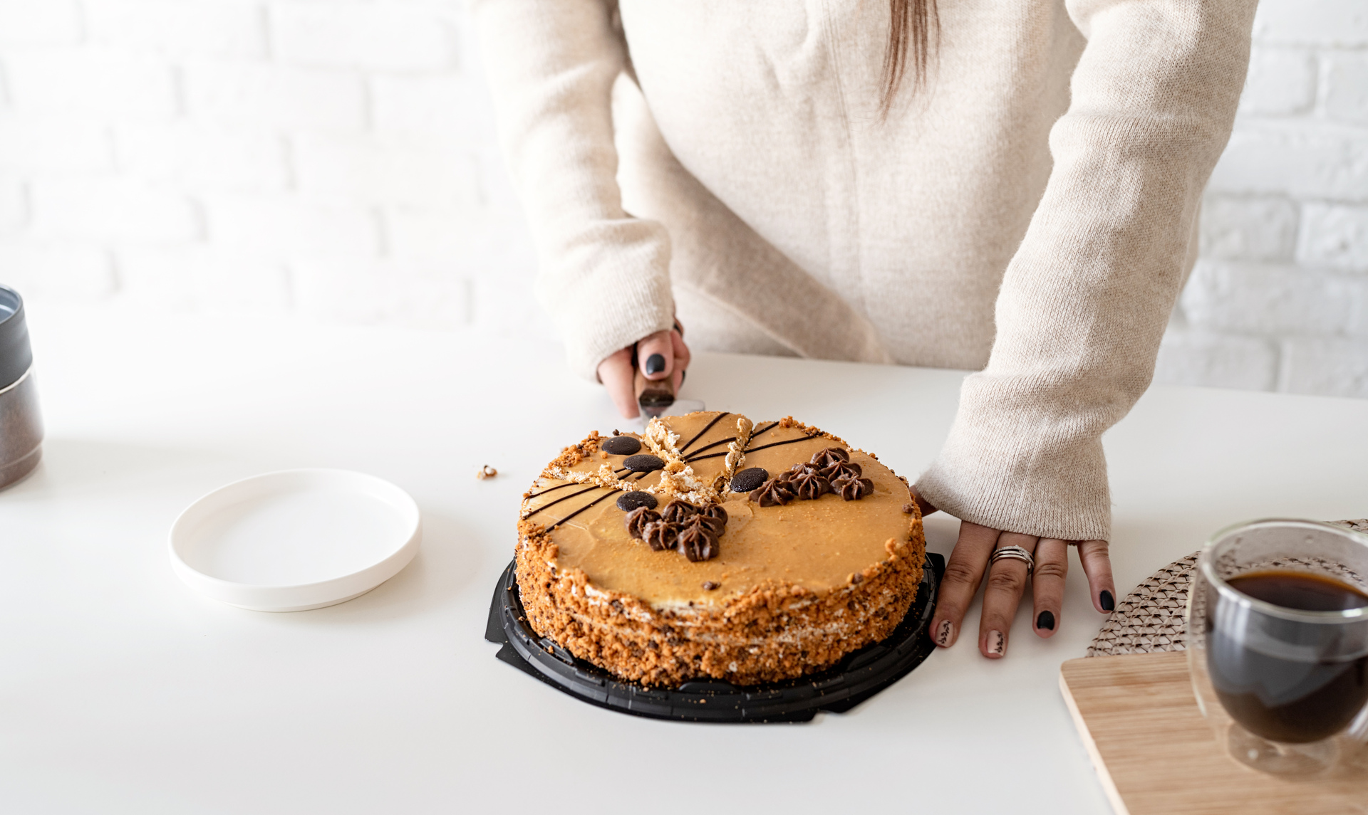 1920-close-up-of-woman-hands-cutting-a-cake.jpg