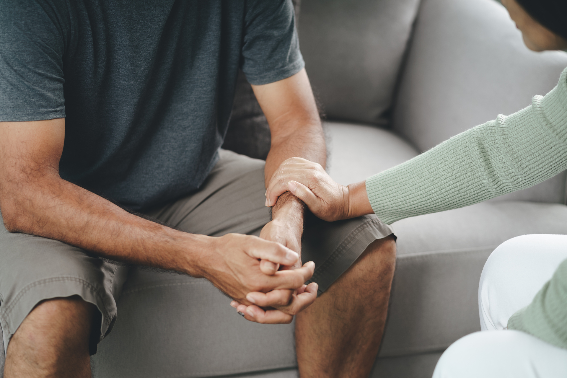 1920-female-friend-or-family-sitting-and-hold-hands-during-cheer-up-to-mental-depress-man-psychologist-provides-mental-aid-to-patient-ptsd-mental-health-concept.jpg