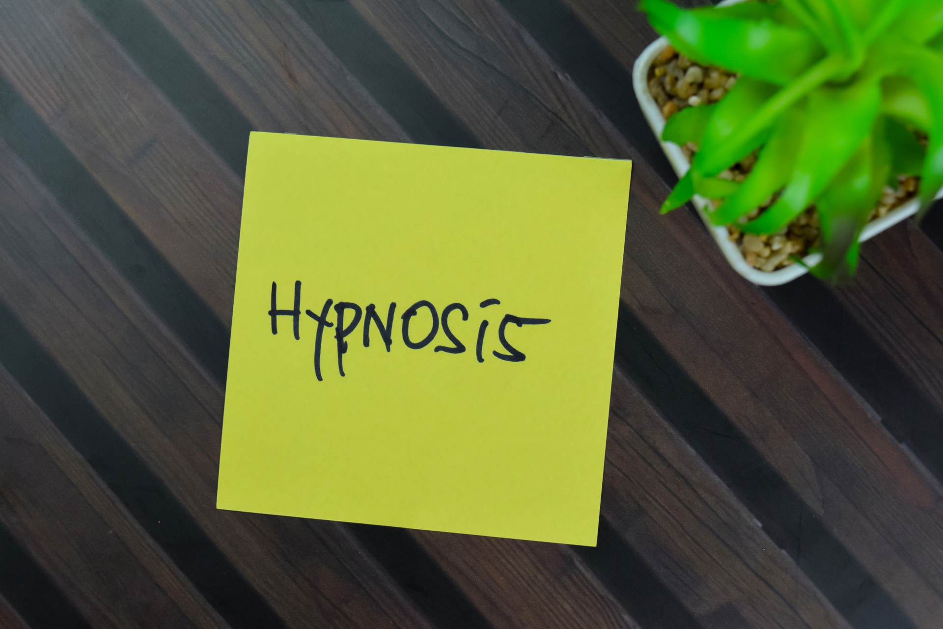 1920-hypnosis-write-on-sticky-notes-isolated-on-wooden-table.JPG