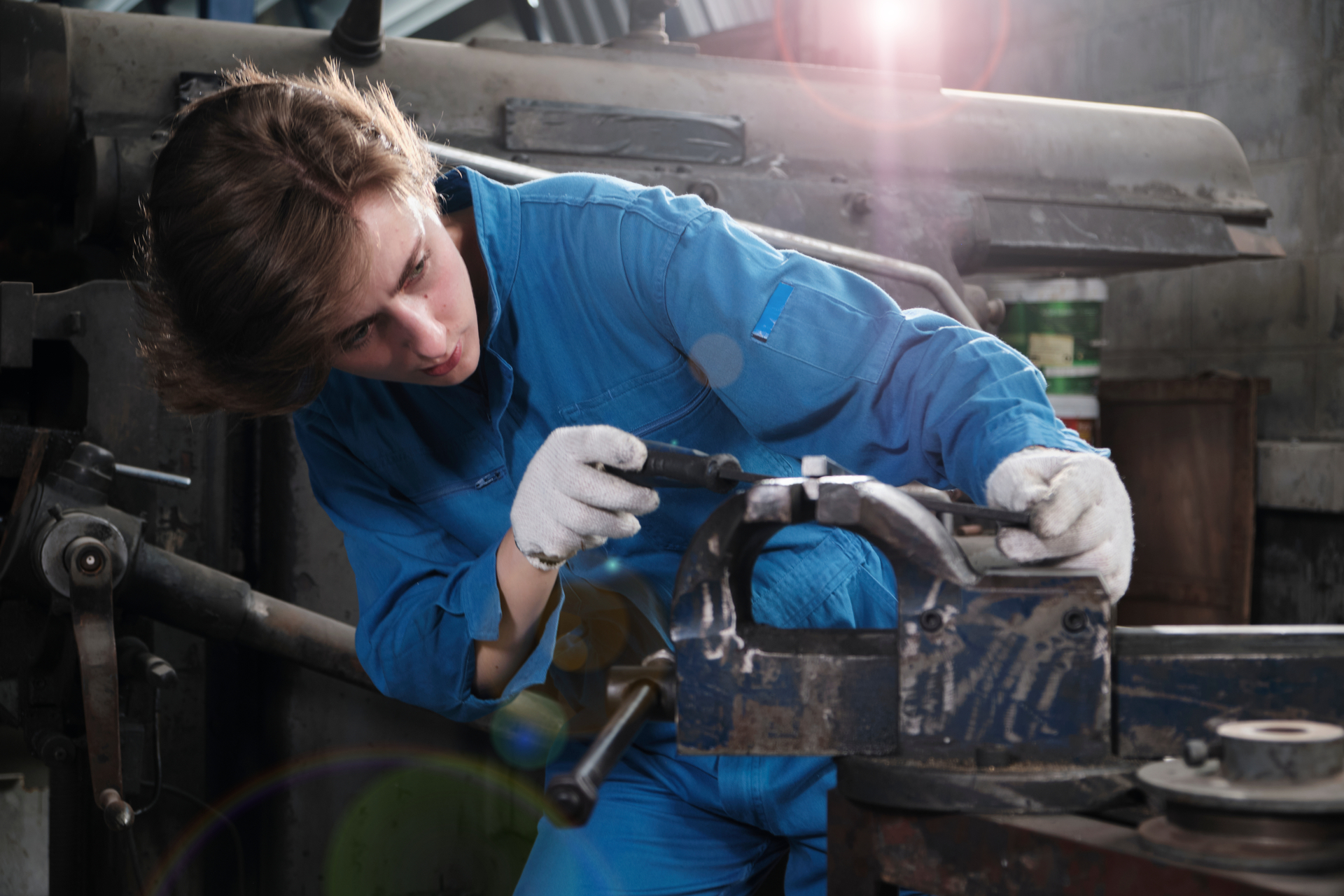 1920-one-professional-young-female-industry-engineer-worker-works-in-a-safety-uniform-with-metalwork-precision-tools-mechanical-lathe-machines-and-spare-parts-workshop-in-the-steel-manufacturing-factory.jpg