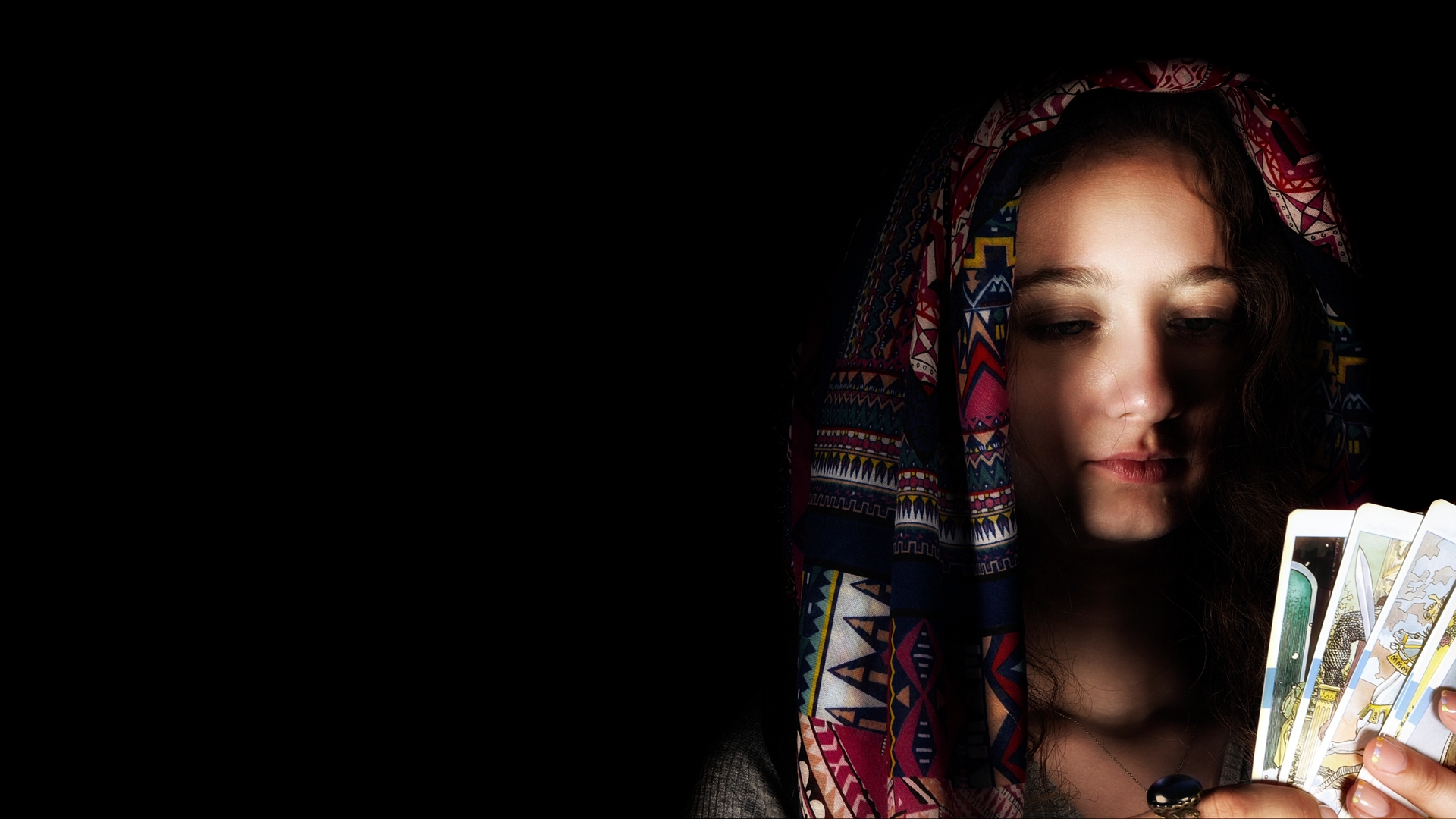 1920-young-girl-in-headscarf-pose-holding-tarot-cards.jpg